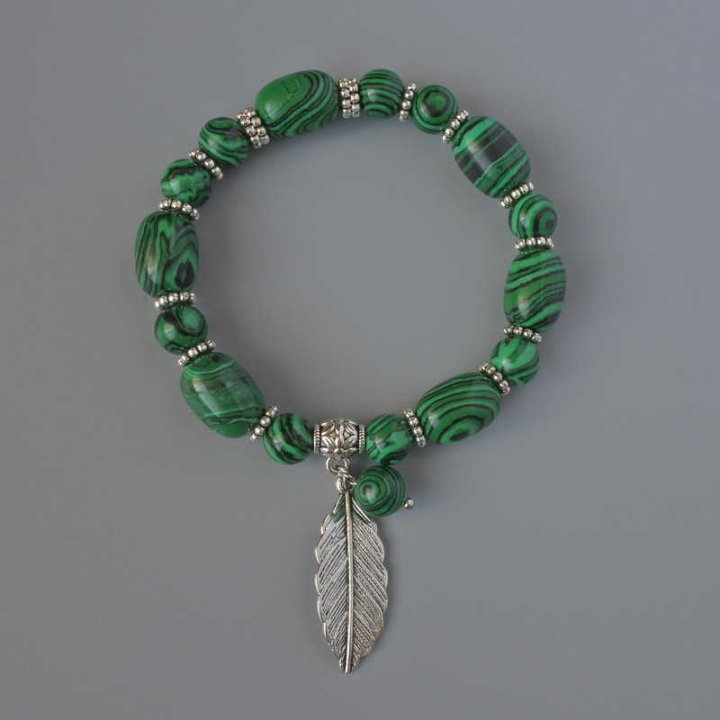 Malachite (pressed) Bracelet, diameter 10x14mm, 8mm+/-, length 18cm +/- with metal inserts (stretch)