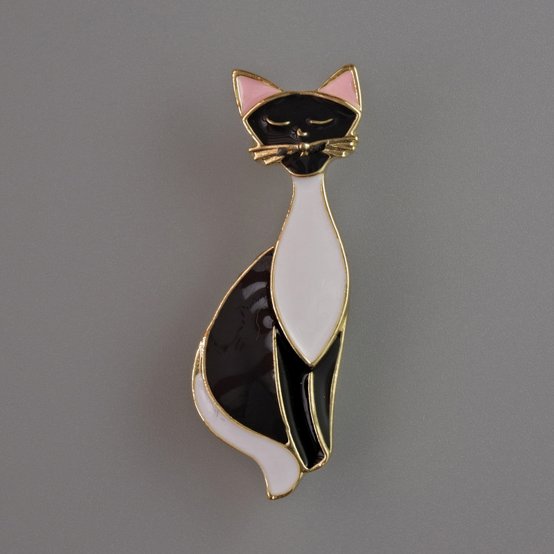 Cat Brooch black and white enamel, gold-tone metal 37x13mm