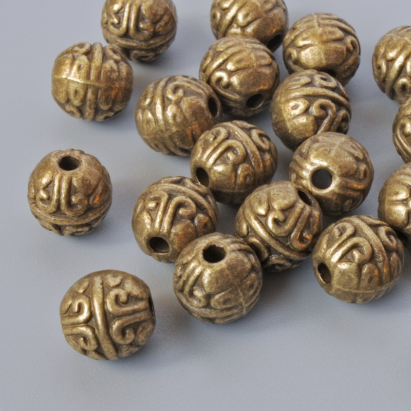 Finding Insert Bead, diameter 7mm, hole diameter 1.7mm, pack 16pcs+/- bronze colour metal