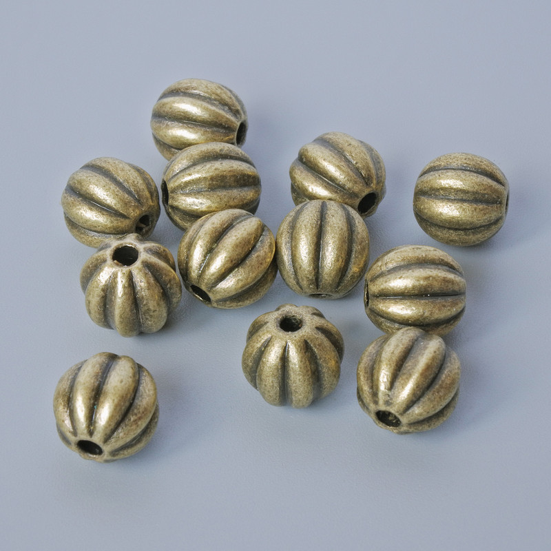Finding Insert Bead, diameter 7.5x8mm, hole diameter 1.5mm, pack 12pcs+/- bronze colour metal