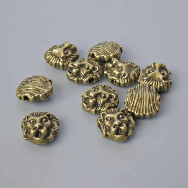 Finding Insert Bead "Lion", diameter 12x11x6mm, hole diameter 1.7mm, pack 10pcs+/- bronze colour metal