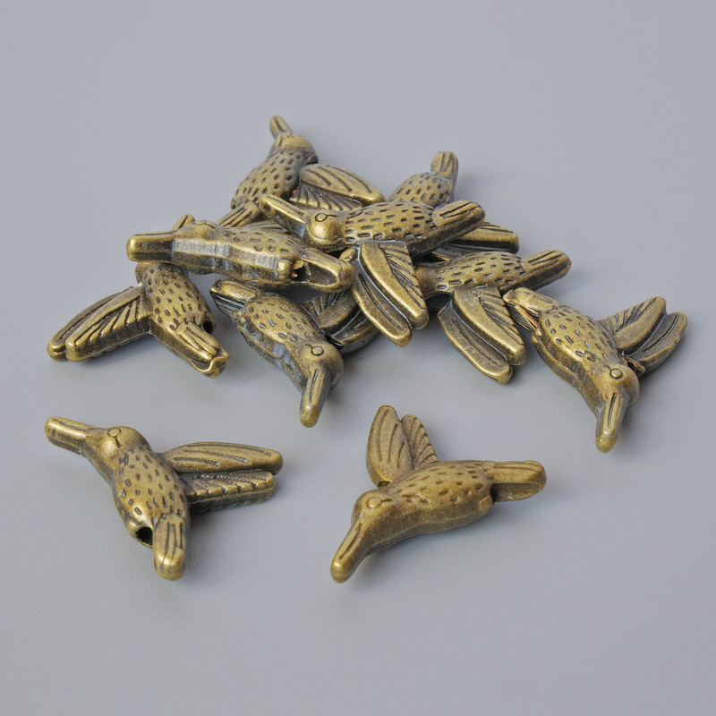 Findings bead insert "Hummingbird", diameter 14x18.5x4.5mm, hole diameter 1mm, pack 10pcs+/- bronze colour metal