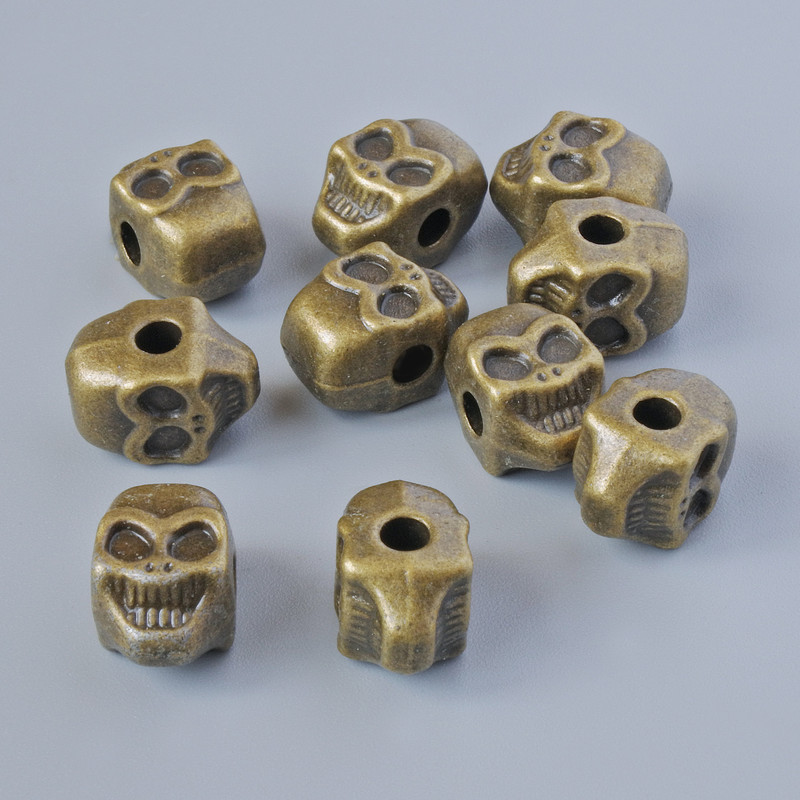 Findings bead insert "Skull", diameter 11x8x7mm, hole diameter 2.6mm, pack 10pcs+/- bronze colour metal