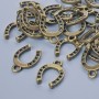 Findings pendant "Horseshoe", diameter 15x11mm, hole diameter 1.9mm, pack 24pcs+/- bronze colour metal
