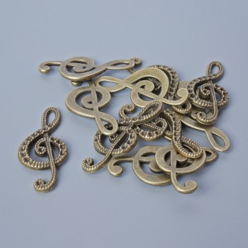 Findings pendant "Treble Clef", diameter 33x14.5mm, hole diameter 5.5x2mm, pack 11pcs+/- bronze colour metal