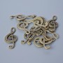 Findings pendant "Treble Clef", diameter 33x14.5mm, hole diameter 5.5x2mm, pack 11pcs+/- bronze colour metal