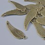 Pendant Finding "Wing", diameter 30×9mm, hole diameter 1.6mm, packaging 15pcs±, bronze colour metal
