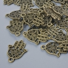 Finding Pendant "Hamsa", diameter 21x15mm, hole diameter 1.7mm, packaging 24pcs±, bronze metal colour