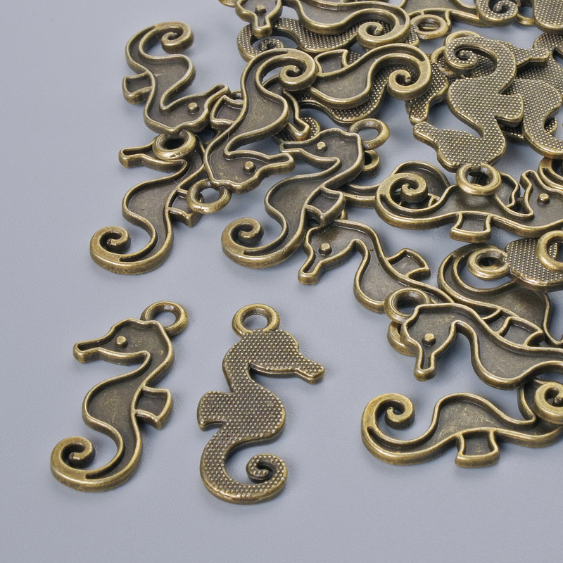 Pendant Findings "Sea Horse", diameter 22x10mm, bore diameter 2.1mm, pack 26±, bronze colour metal