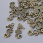 Pendant Findings "Sea Horse", diameter 22x10mm, bore diameter 2.1mm, pack 26±, bronze colour metal