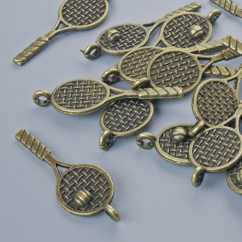 Finding Pendant "Racquet", 29x10mm, hole diameter 1.8mm, pack of 17pcs+/- bronze metal colour