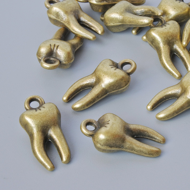 Finding Pendant "Tooth", 15.5x7.5mm, hole diameter 1.6mm, pack of 15pcs+/- bronze metal colour