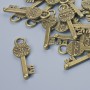 Finding Pendant "Key", 26x8mm, hole diameter 3.5mm, pack of 16pcs+/- bronze metal colour