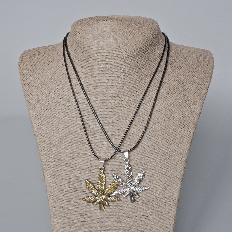Matching Pendants "Hemp Leaf" bronze and silver metal 44x37mm +/-, length 45-50cm+