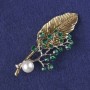 Brooch-Pendant Twig, Green Crystals, White Bead, Gold-Tone & Silver-Tone Metal 76x33mm+