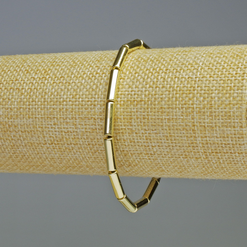 Hematite Bracelet Cylinder Light Gold Colour, diameter 13x4mm+/-, length 18cm+/- stretch