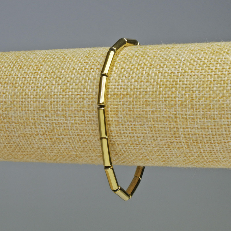 Hematite Bracelet Cylinder Gold Colour, diameter 12x4mm+/-, length 18cm+/- stretch