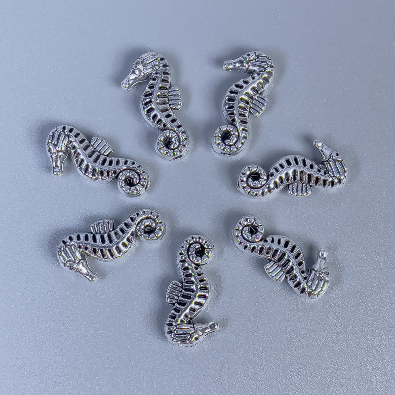 Findings Seahorse Spacer Bead, Silver Metal Colour, Diameter 15x7x3mm+/-, Hole Diameter 1mm+/-, Pack of 11pcs