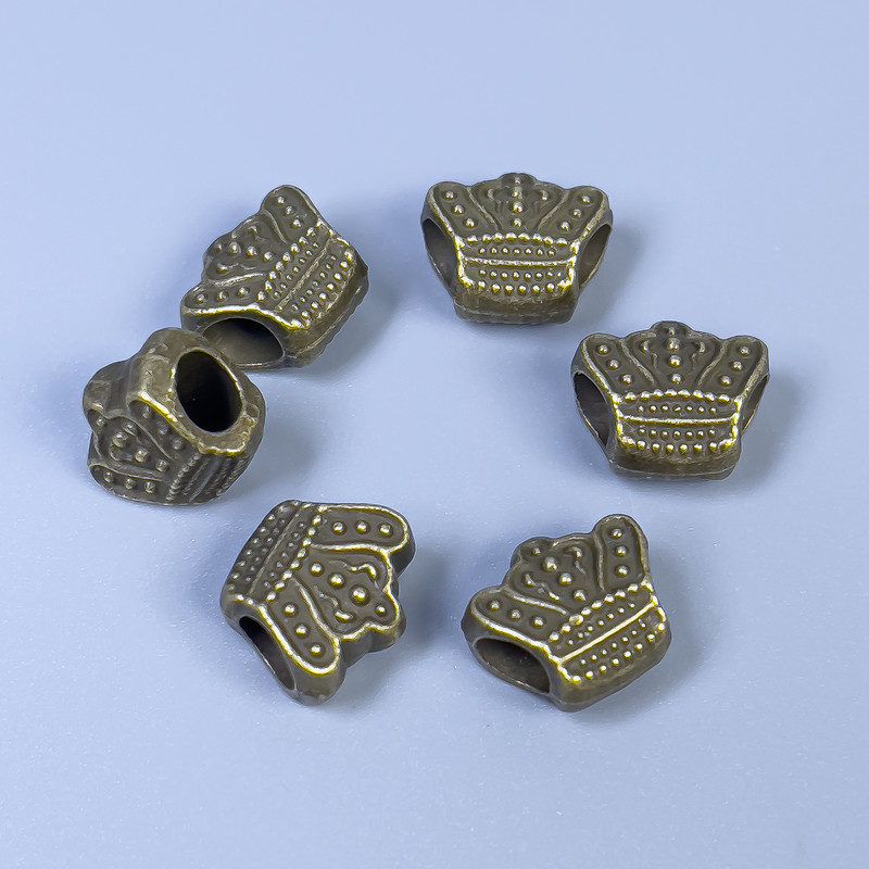 Bead insert finding Crown, bronze metal colour, diameter 11x10x6mm+/-, hole diameter 4mm+/-, pack of 11 pcs