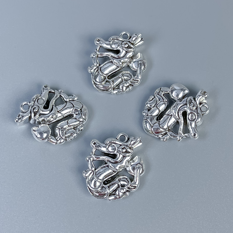 Dragon pendant finding, silver metal colour, size 21x17x7mm+/-, hole diameter 1.2mm+/-, pack of 4 pcs