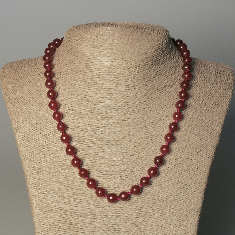 Necklace of tinted quartz smooth beads, diameter 8mm±, length 50mm± with clasp