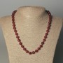 Necklace of tinted quartz smooth beads, diameter 8mm±, length 50mm± with clasp