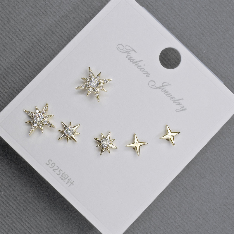 Stud Earrings 10-6mm± golden metal with white crystals