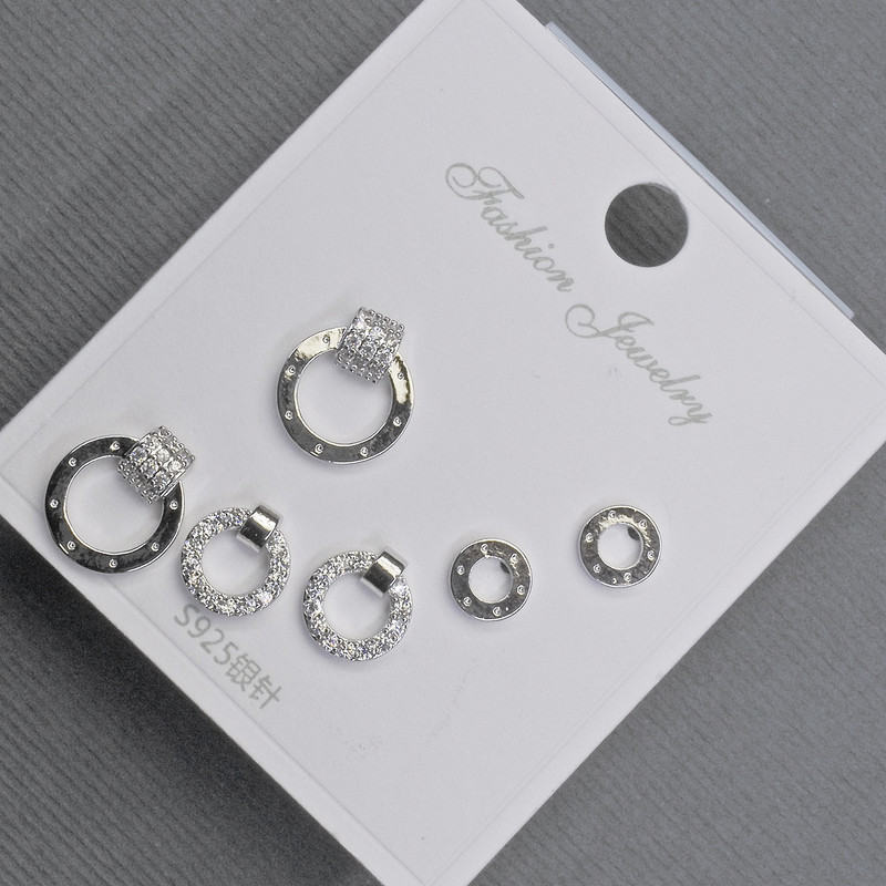 Earrings, stud, silvered metal with white crystals