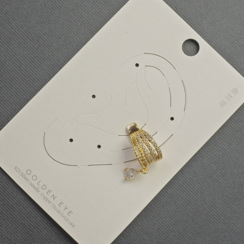 Cafe stud earring in golden metal 10x14mm± with white crystals