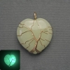 Pendant Heart Onyx glows in the dark in a golden weave, diameter 30x30mm±, length 37mm±