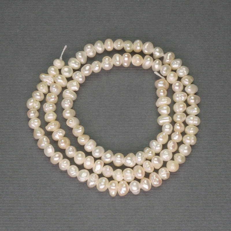 River White Pearls Oval on a Strand, diameter 3x4mm+/- on a strand, length 34cm+