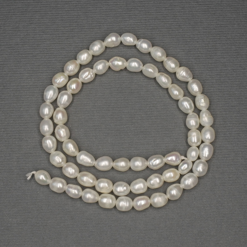 Freshwater white oval pearls on a thread, diameter 6x4, 5-5mm± on thread, length 36cm+