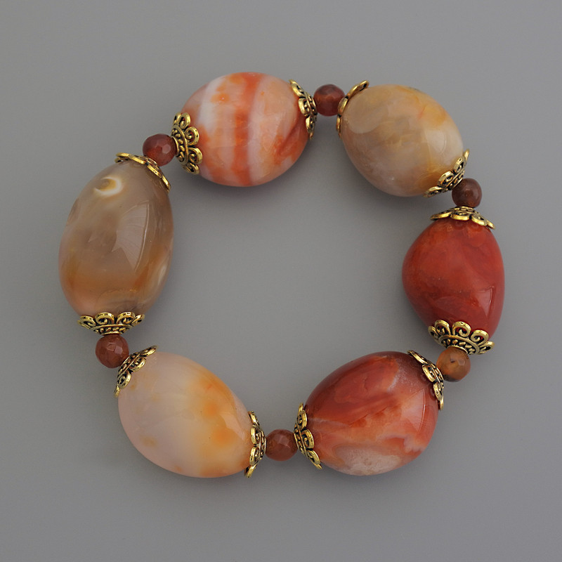 Clearance! Carnelian Tumbled Bracelet, diameter 23x20mm+/- faceted bead 6mm+/-, length 18cm stretch
