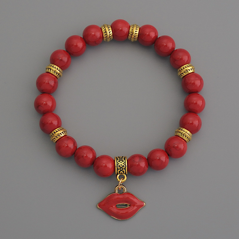 Coral (Artificial) Bracelet, smooth bead, diameter 8mm+/- with metal inserts, length 18cm stretch