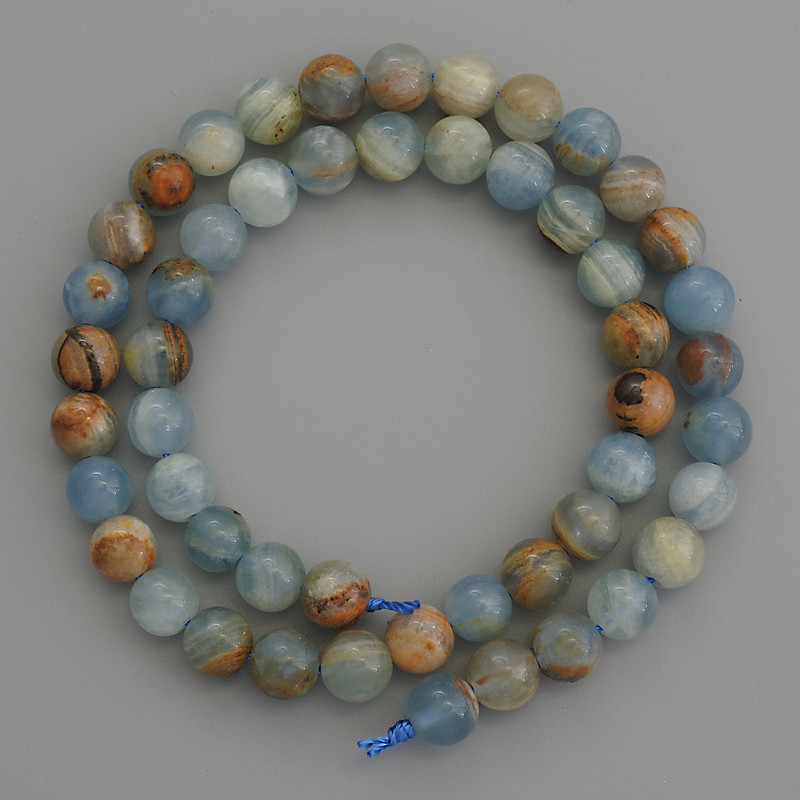Blue Calcite Beads smooth round 8mm+/- on a strand, length 39cm+