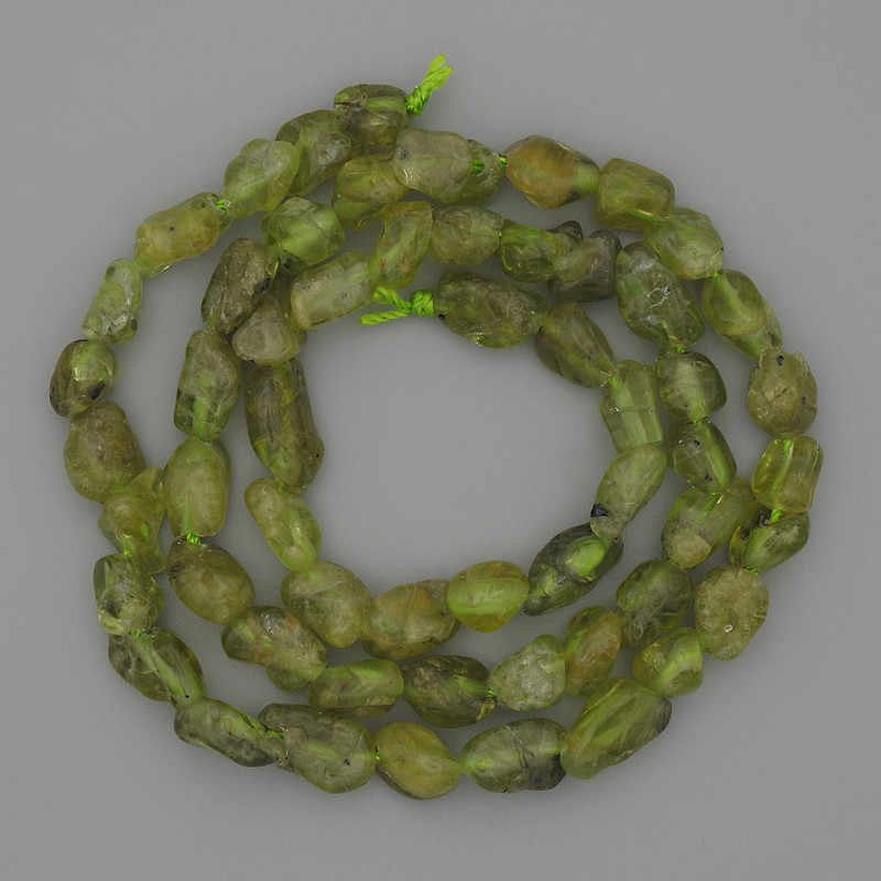 Chrysolite Beads Tumbled on Thread, diameter 9x5mm+-, length 39cm+