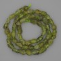 Chrysolite Beads Tumbled on Thread, diameter 9x5mm+-, length 39cm+