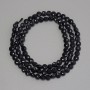 Black tourmaline faceted round beads, coin-shaped, 4mm diameter, approximately 39cm length on thread