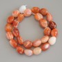 Carnelian Tumbled Beads, diameter 16-19x11-13mm+/- on a thread, length 40cm+