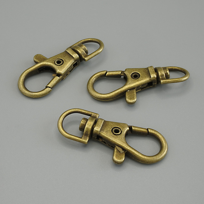 Price per Pack /10pcs. Lobster Clasp, diameter 38x18mm, metal colour bronze