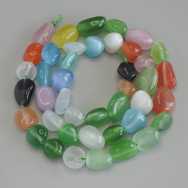 Multicoloured Cat's Eye Beads, tumbled, diameter 8-12x9mm+-, length 41cm+- on a strand