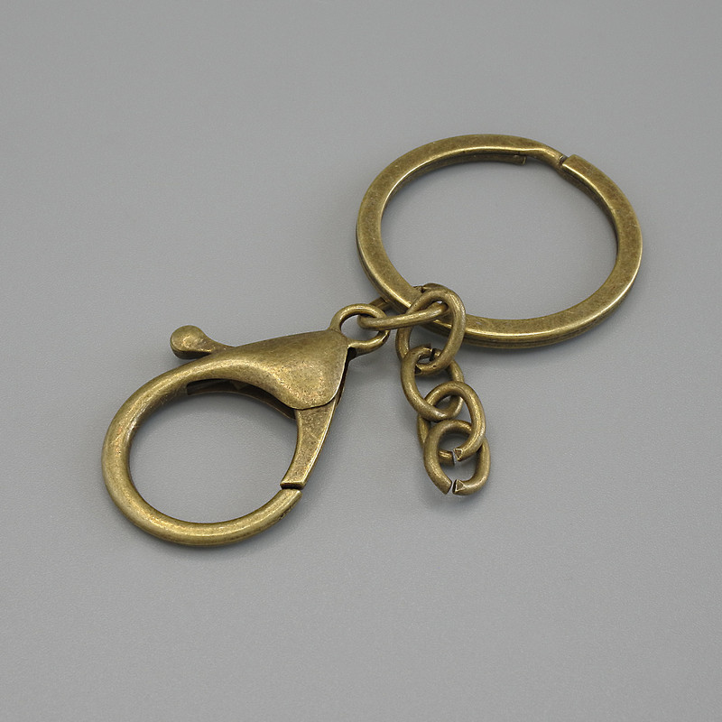 Price per Pack /10pcs. Keyring Base with Two Fittings — Carabiner 33x24mm+/- and Ring, Diameter 3cm, Length 7cm