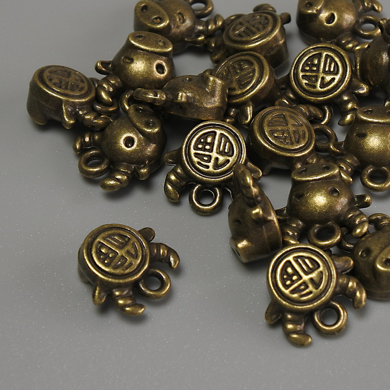 Findings Bull Pendant bronze metal colour, size 10x9x5mm+- hole diameter 1mm+- pack 20g (~17pcs)