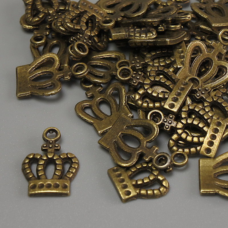 Findings Crown Pendant bronze metal colour, size 15x10x1mm+- hole diameter 2mm+- pack 20g (~36pcs)