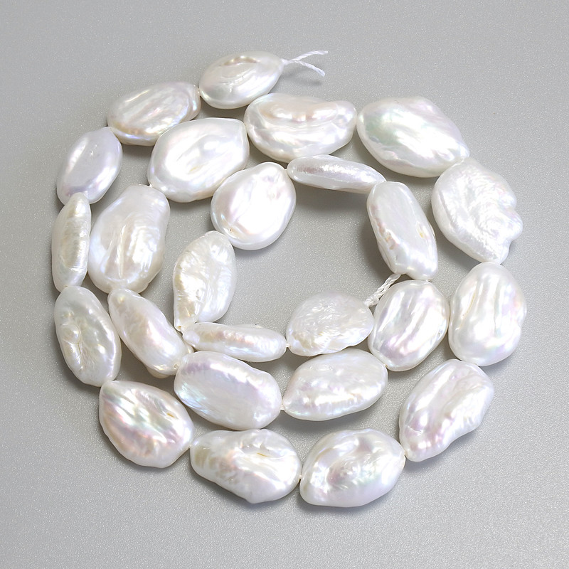 Baroque pearls with a petrol-tone, on thread, diameter 15-18×10-12 mm +/-, length 39 cm+