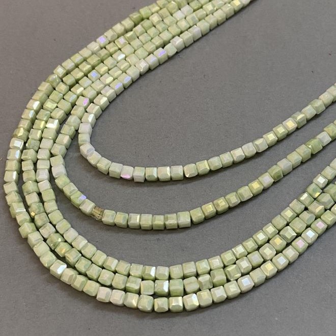 Czech Crystal Beads Light Green with Petrol Coating on Thread, Faceted Cube, Diameter 4x4mm +/-, Length 38cm +
