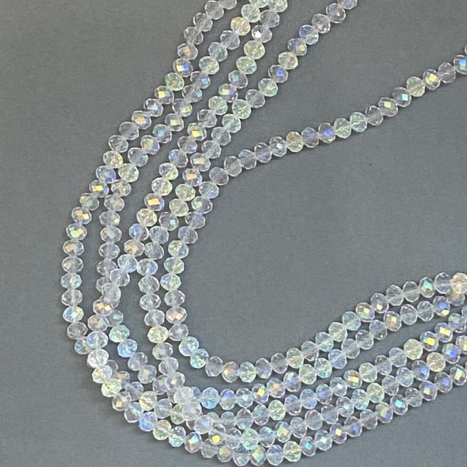 Beads 'Czech Crystal' on a thread, white, transparent with oil-sheen iridescence, faceted rondelle, diameter 6×5mm ±, length 39cm ±