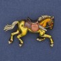 Brooch 'Horse' with yellow enamel and white crystals, golden metal 50x32mm