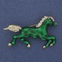 Brooch Horse with green enamel and white rhinestones, gold-tone metal 50x32mm+