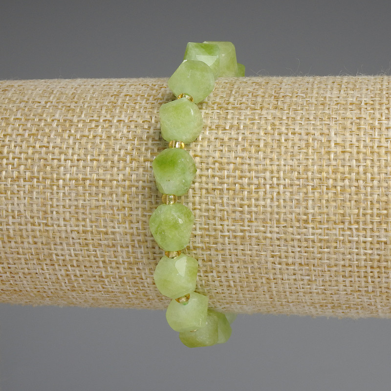 Chrysolite Olivine Bracelet, faceted rhombus 9x8mm+/-, spacer beads 3mm+/-, length 18cm+/- stretch